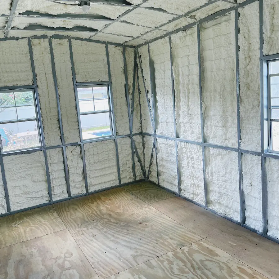 Closed-cell spray foam insulation applied to wall cavities in a residential project in Rensselaer